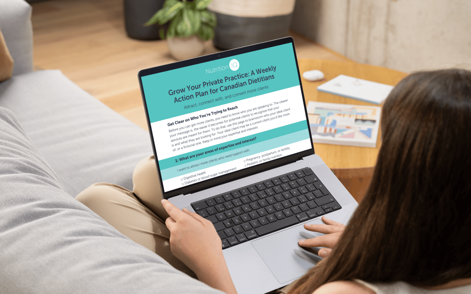 A Canadian Dietitian reading a Free handout to Attract, connect with, & convert more clients in a few simple steps